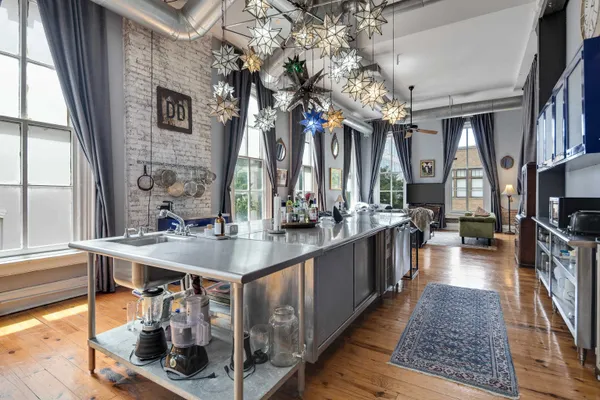 a kitchen with sink a counter and cabinets