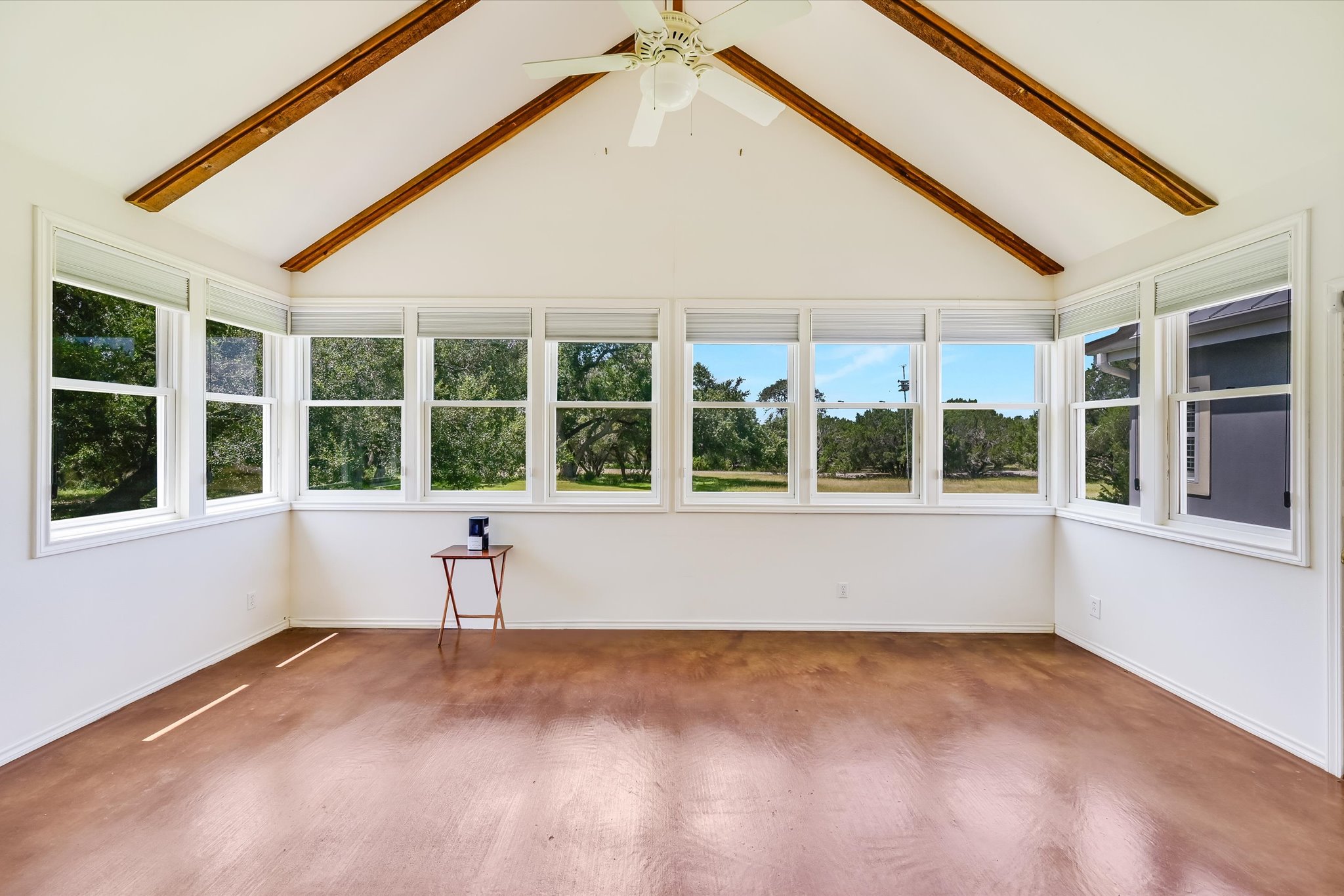 3820 River Road Wimberley, TX 78676 - Photo 9 of 37 Sunroom adjacent to living room is inviting gathering space