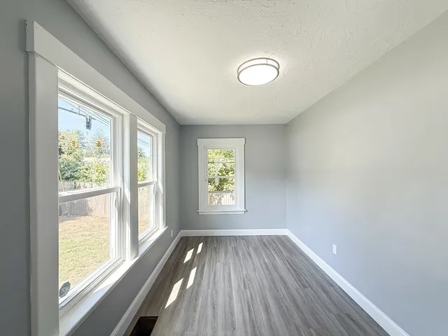 a view of an empty room and glass door