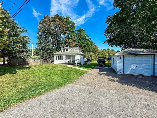 a view of a pathway with a wrought fence
