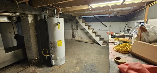a close view of an empty room with wooden floor and a window
