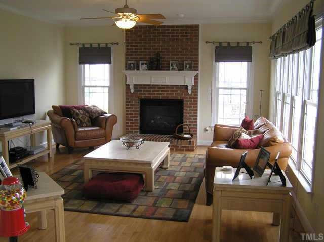310 Challenge Raleigh, NC 27603 - Photo 4 of 10 Beautiful open family room with tons of windows offering views of golf course. Inviting fireplace w/hearth and beautiful detailed mantel. Custom roman shades. Other