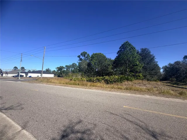 a view of a road with a building in the background