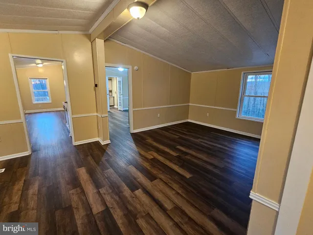 a view of gallery with wooden floor