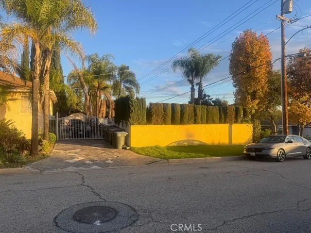 a view of swimming pool with palm trees