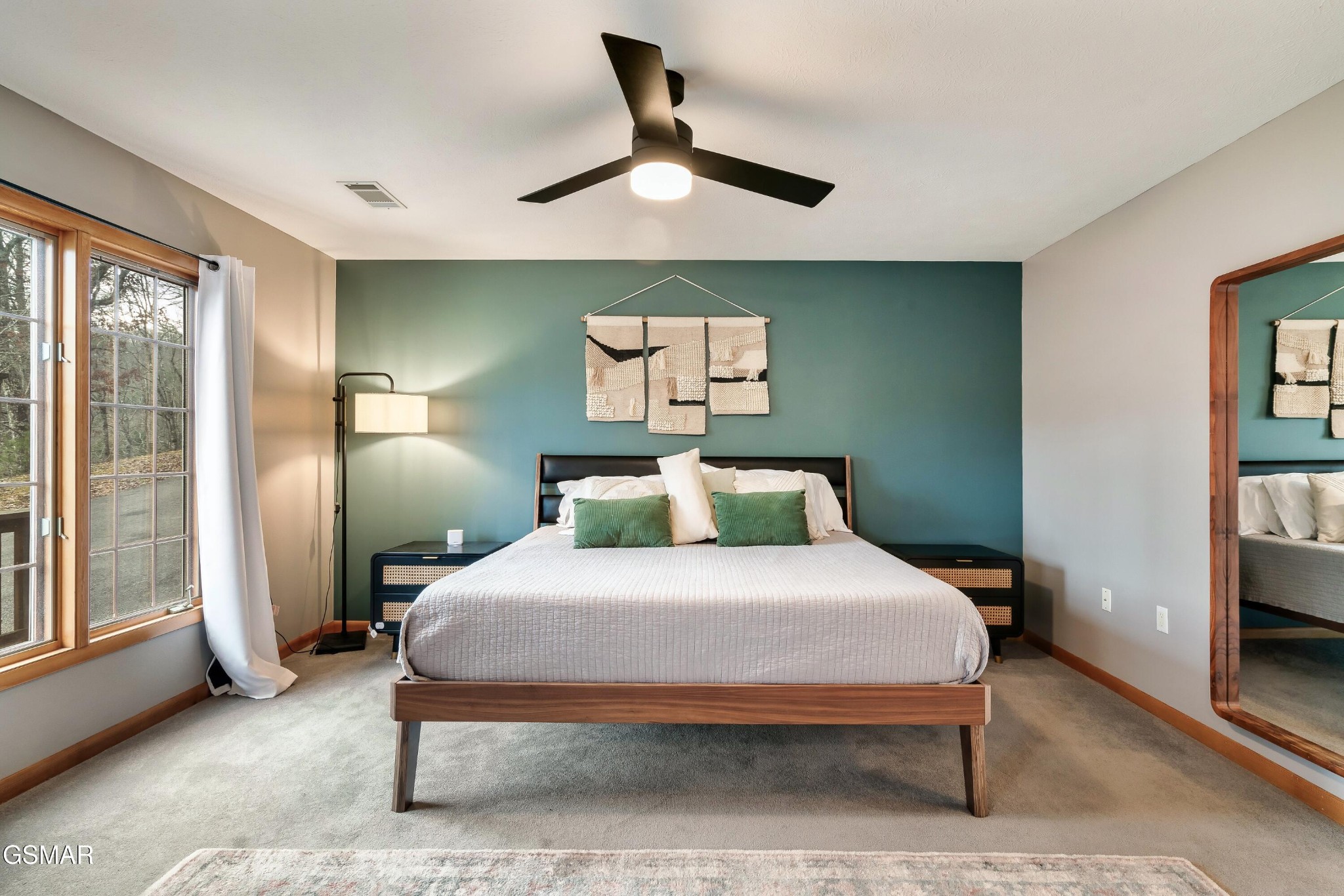 4062 Wilhite Road Sevierville, TN 37876 - Photo 17 of 50 a bedroom with a bed and a chandelier