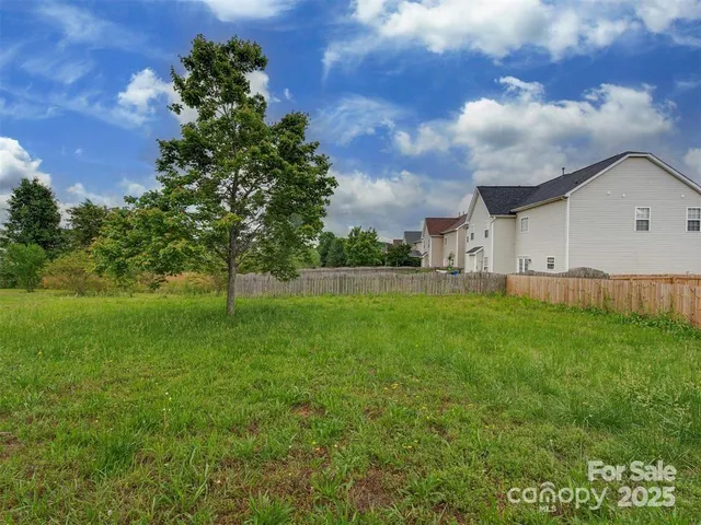 a view of a backyard of the house