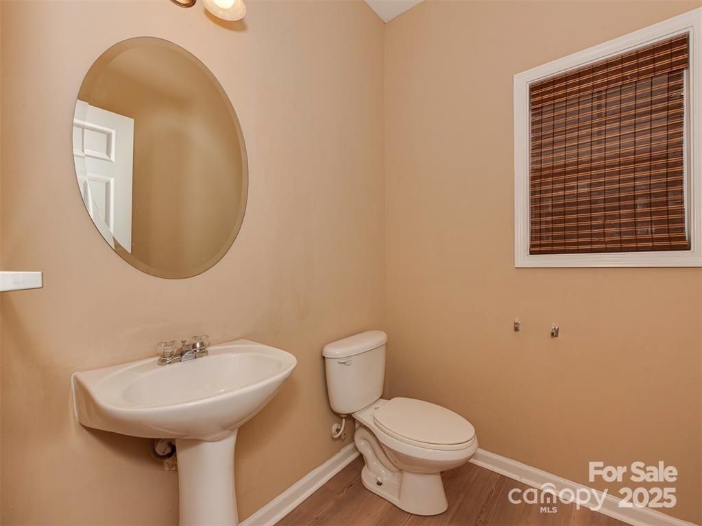 5607 Fulton Ridge Drive Indian Trail, NC 28079 - Photo 7 of 45 a bathroom with a toilet sink and mirror