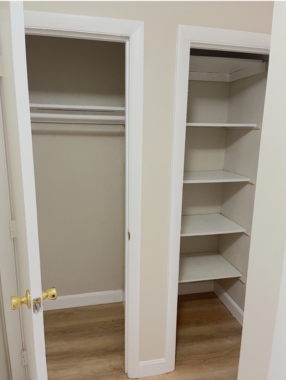 22 Westgate Road, Unit 3 Boston, MA 02467 - Photo 9 of 18 a view of walk in closet with empty racks