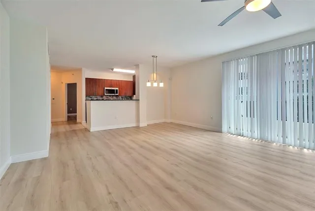 a kitchen with granite countertop stainless steel appliances and cabinets
