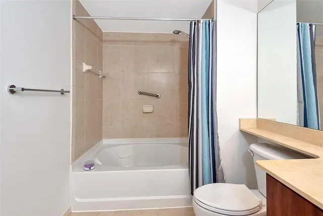 a bathroom with a sink vanity and a mirror