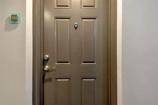 a view of a hallway with a livingroom