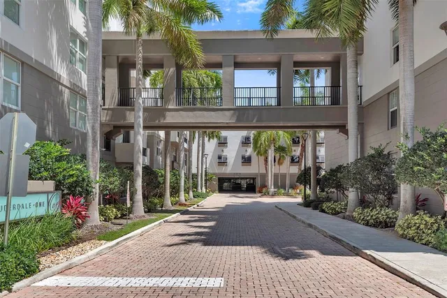 a living room with furniture and a book shelf