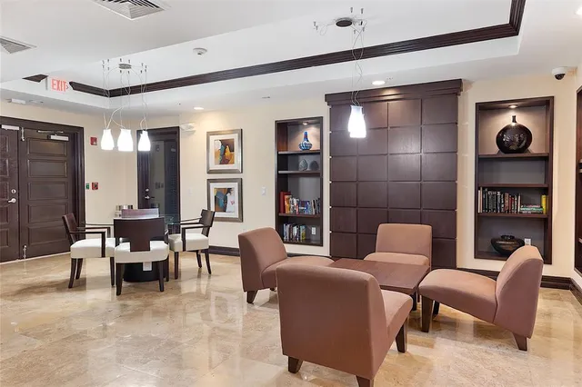 a view of swimming pool with palm trees
