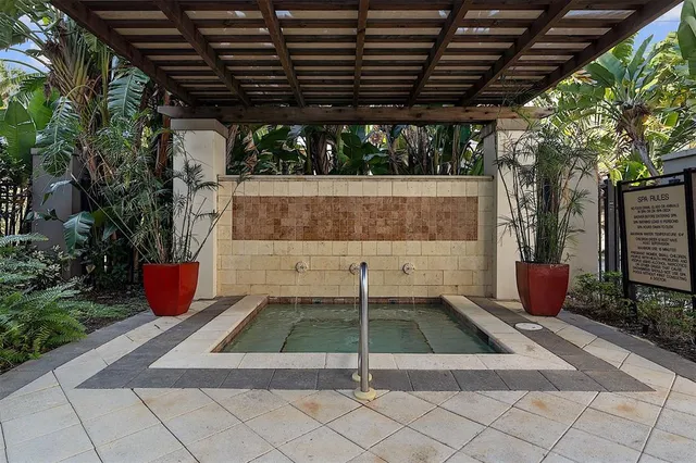 a view of a livingroom with hardwood floor and a large window