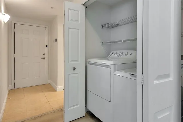 a view of a kitchen with a sink and cabinets