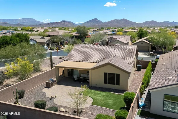 aerial view of a house with a yard