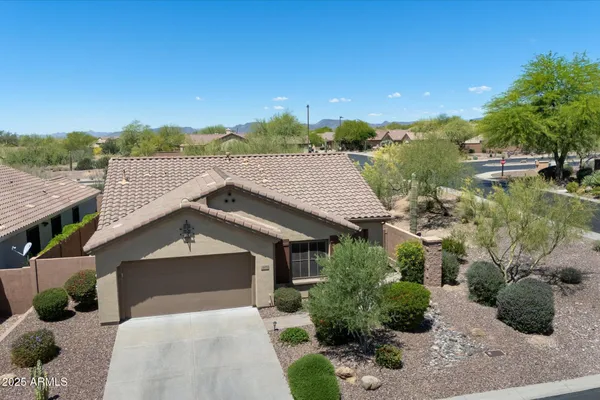 a aerial view of a house with a yard