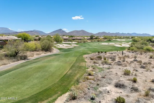 a view of lake with green space