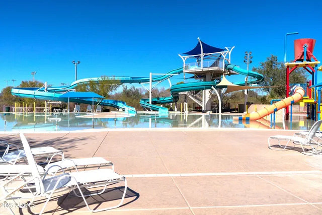 a view of a chairs and table in the patio