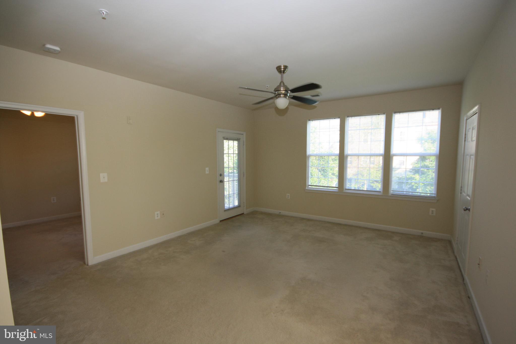 22691 Blue Elder Terrace, Unit 204 Brambleton, VA 20148 - Photo 12 of 45 a view of an empty room with a window