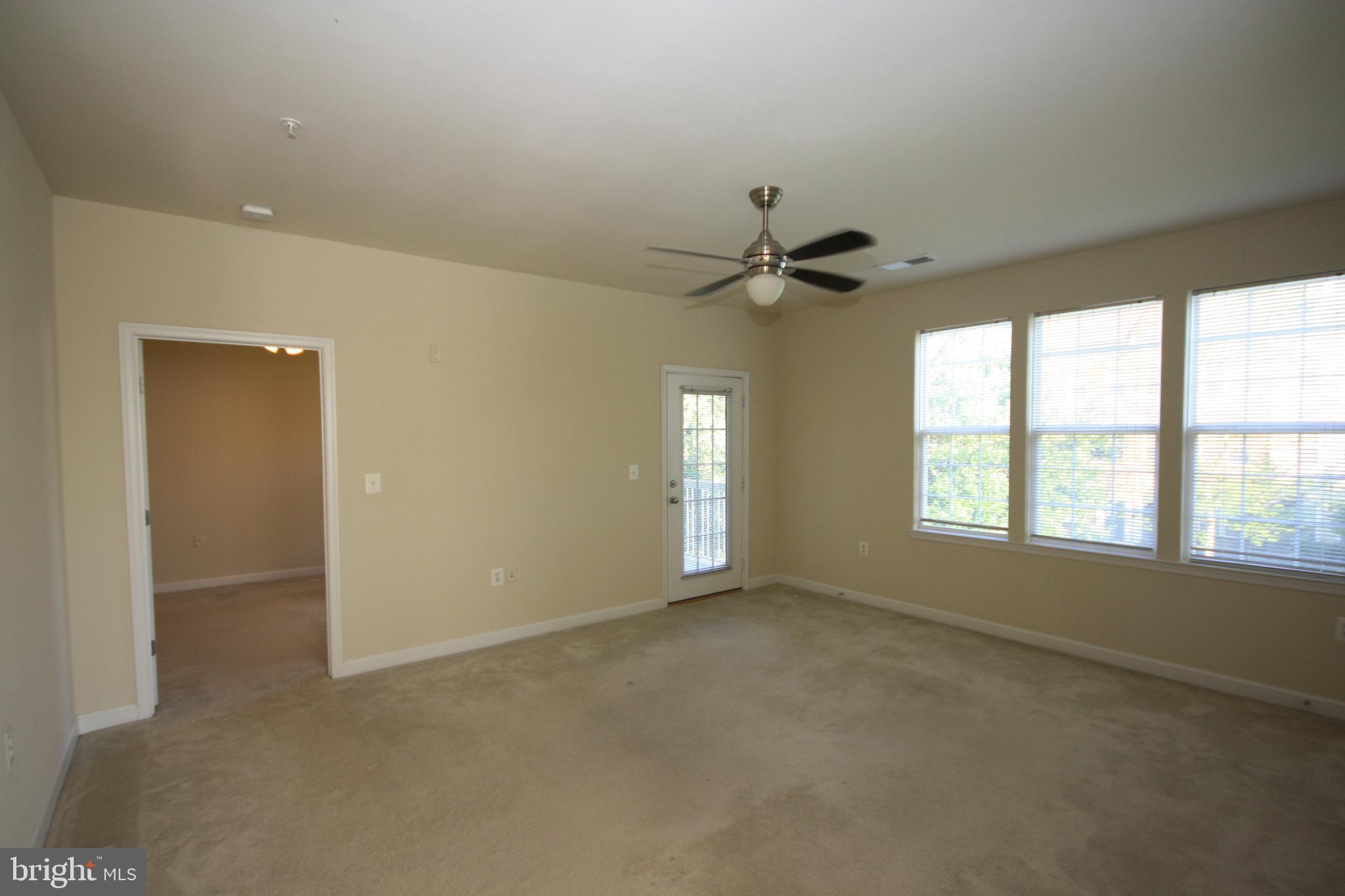 22691 Blue Elder Terrace, Unit 204 Brambleton, VA 20148 - Photo 13 of 45 a view of an empty room with a window