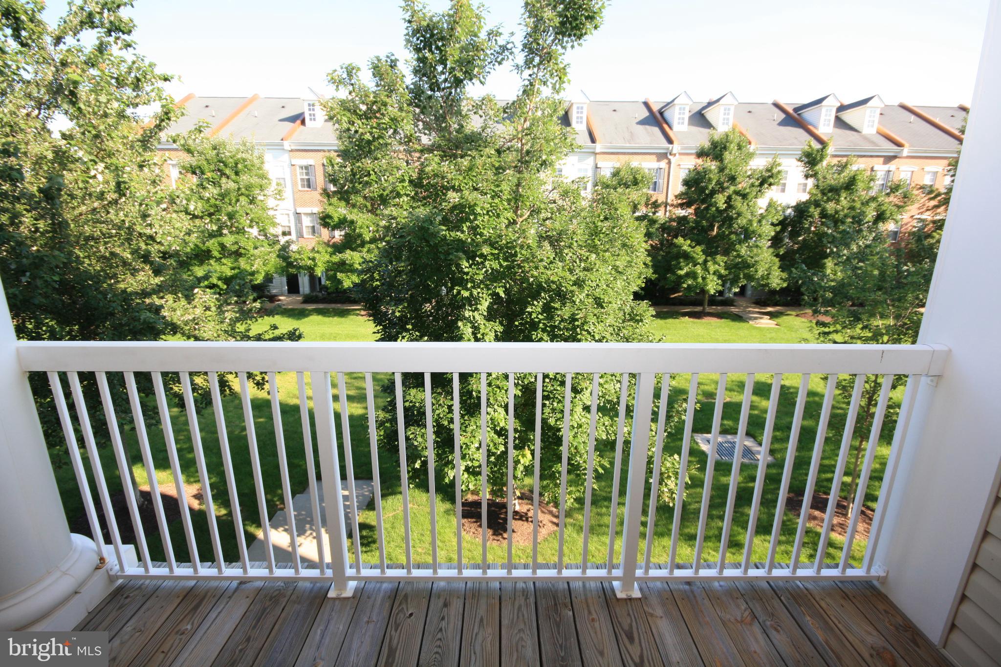 22691 Blue Elder Terrace, Unit 204 Brambleton, VA 20148 - Photo 18 of 45 a view of a wooden roof deck