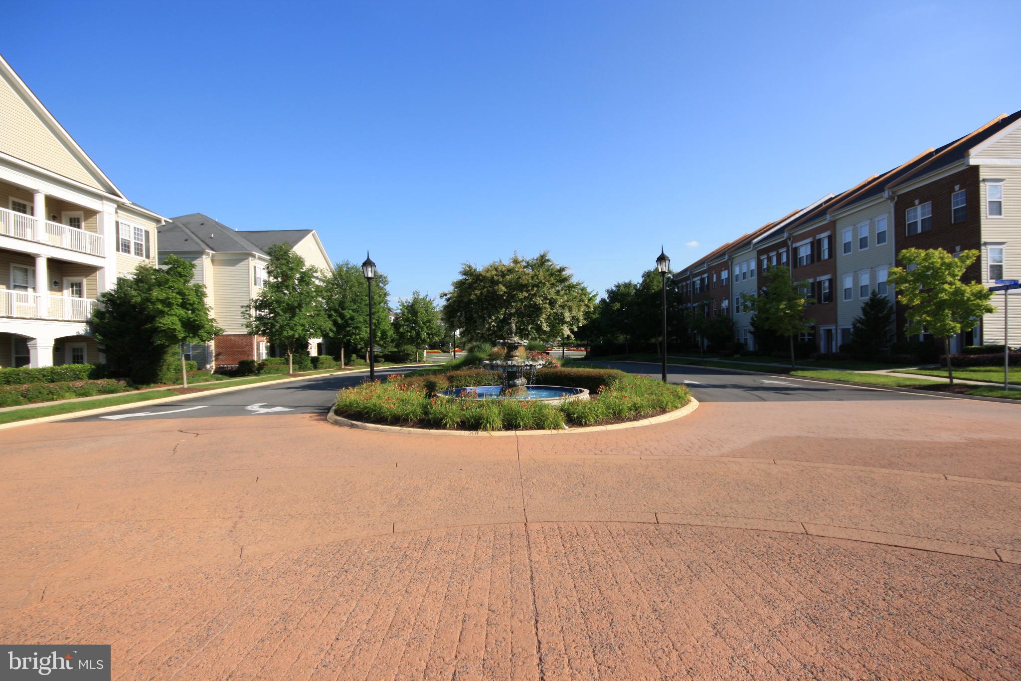 22691 Blue Elder Terrace, Unit 204 Brambleton, VA 20148 - Photo 25 of 45 a view of swimming pool with a yard and plants