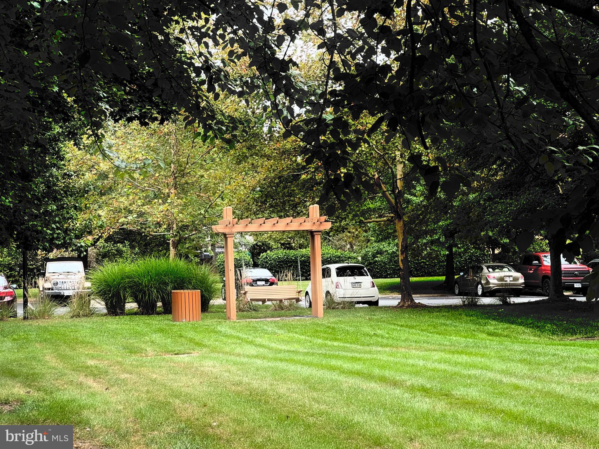 22691 Blue Elder Terrace, Unit 204 Brambleton, VA 20148 - Photo 41 of 45 a view of a house with a backyard