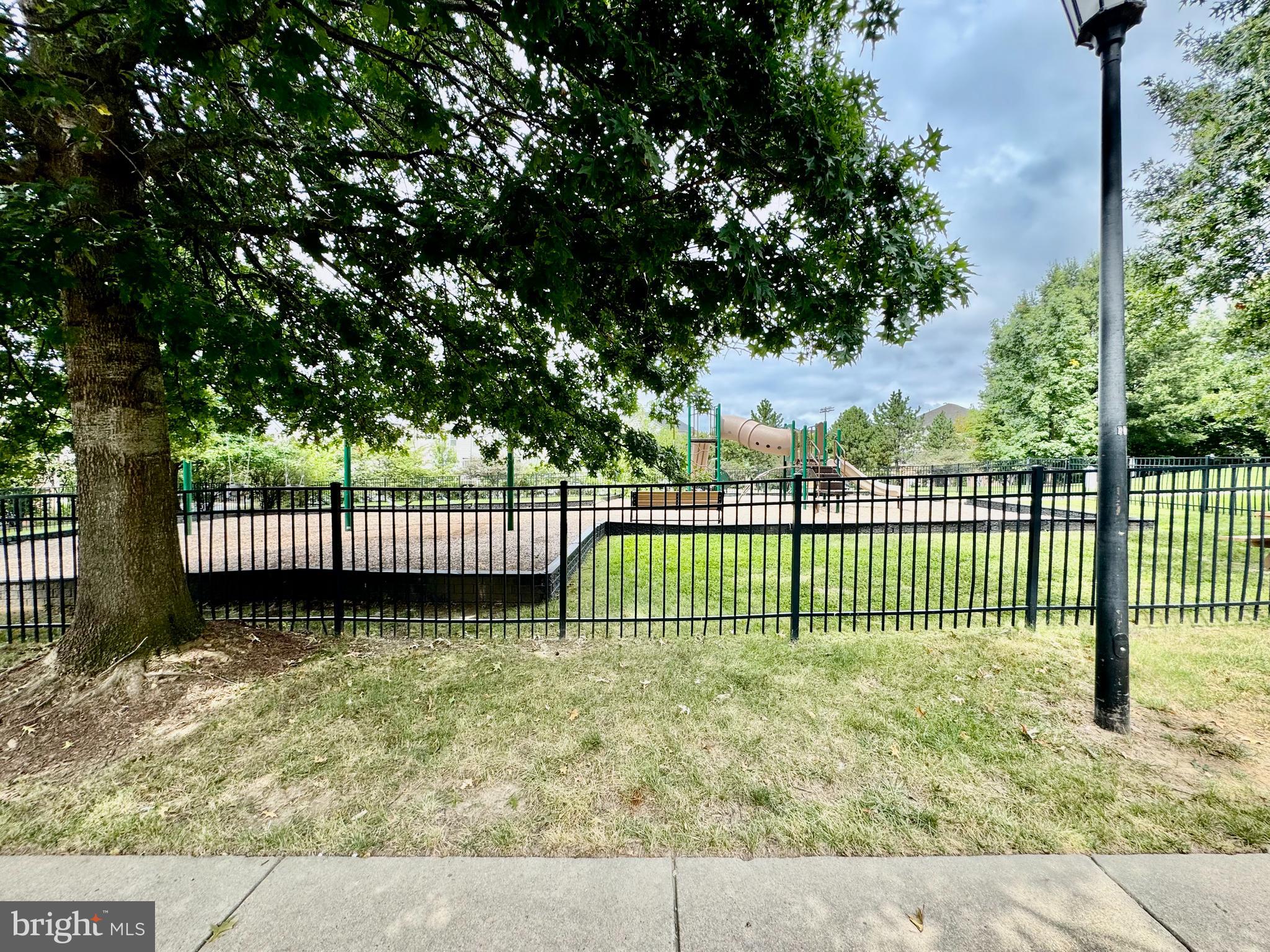 22691 Blue Elder Terrace, Unit 204 Brambleton, VA 20148 - Photo 44 of 45 a view of a wrought iron fences in front of a yard