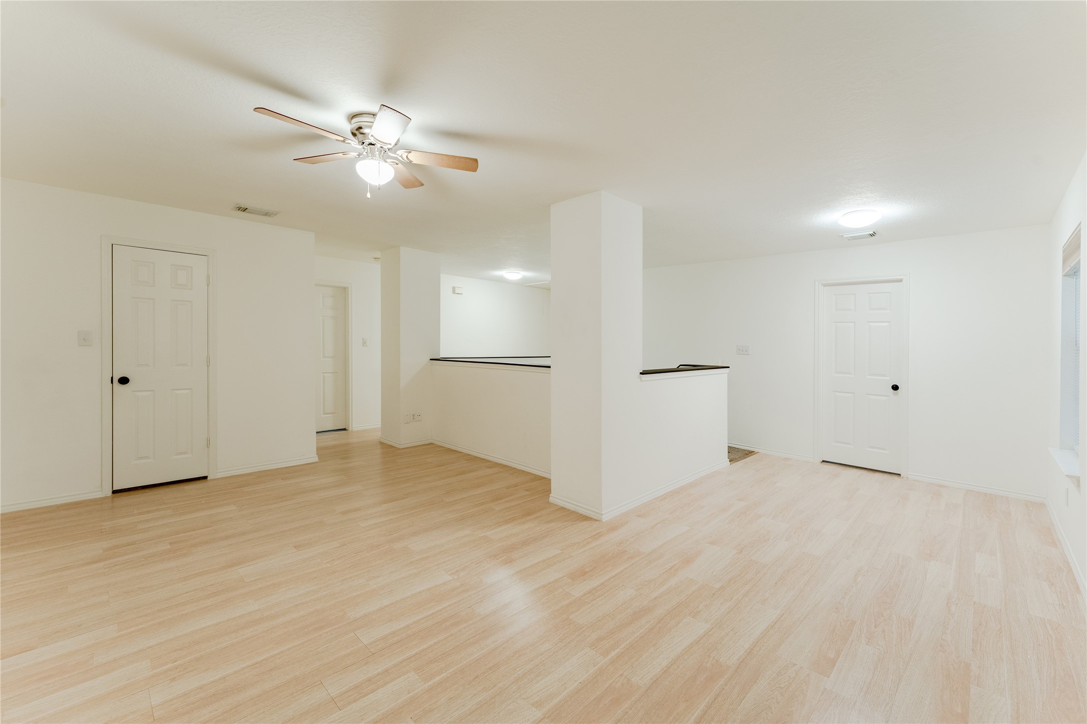 9203 Appin Court Houston, TX 77095 - Photo 15 of 38 a view of an empty room with a chandelier fan