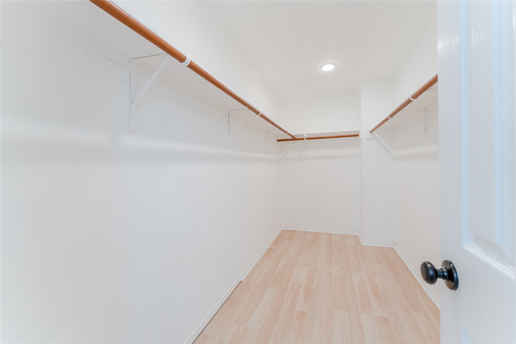 9203 Appin Court Houston, TX 77095 - Photo 20 of 38 a view of a room with racks on the wall