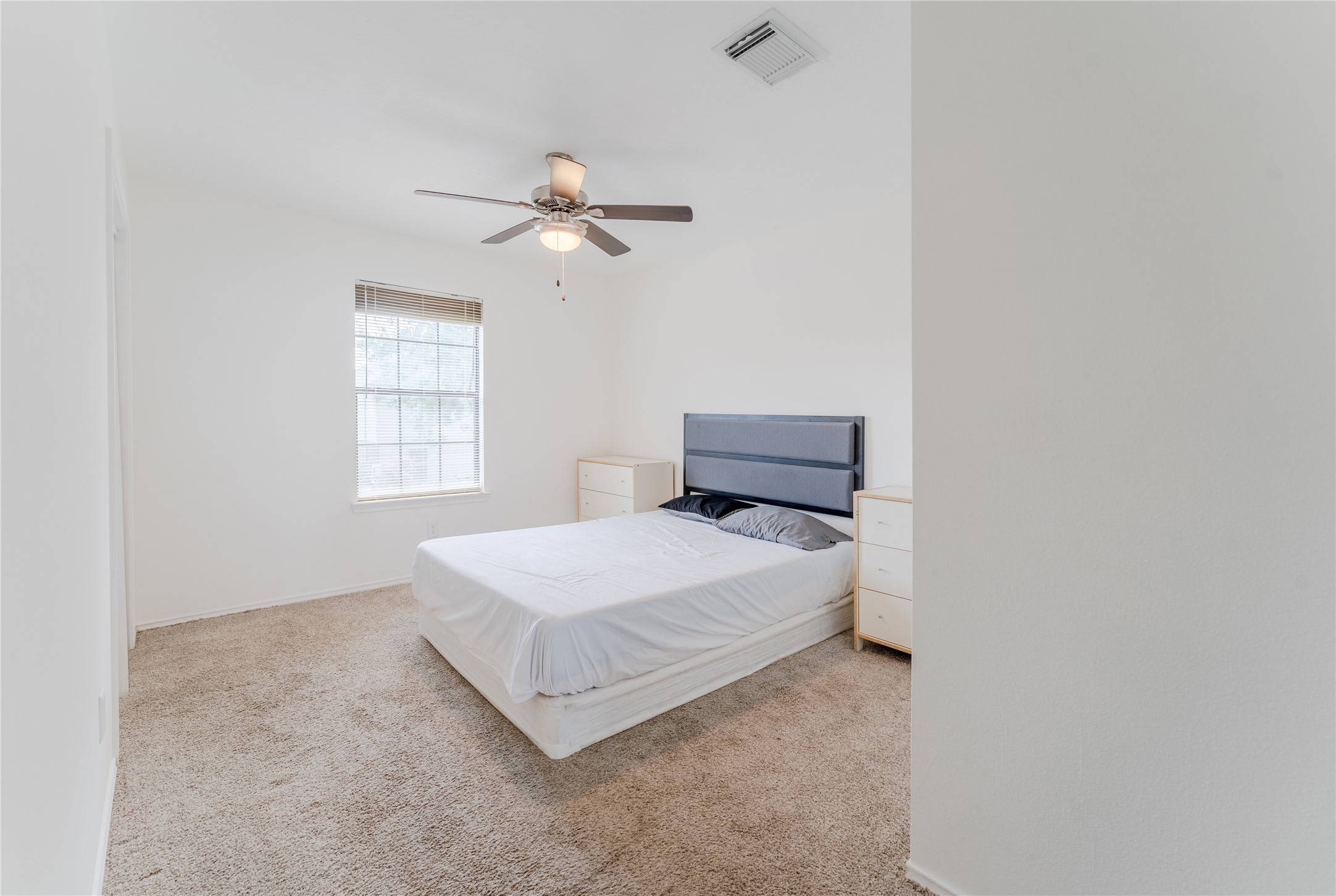 9203 Appin Court Houston, TX 77095 - Photo 21 of 38 a bedroom with a bed a window and closet