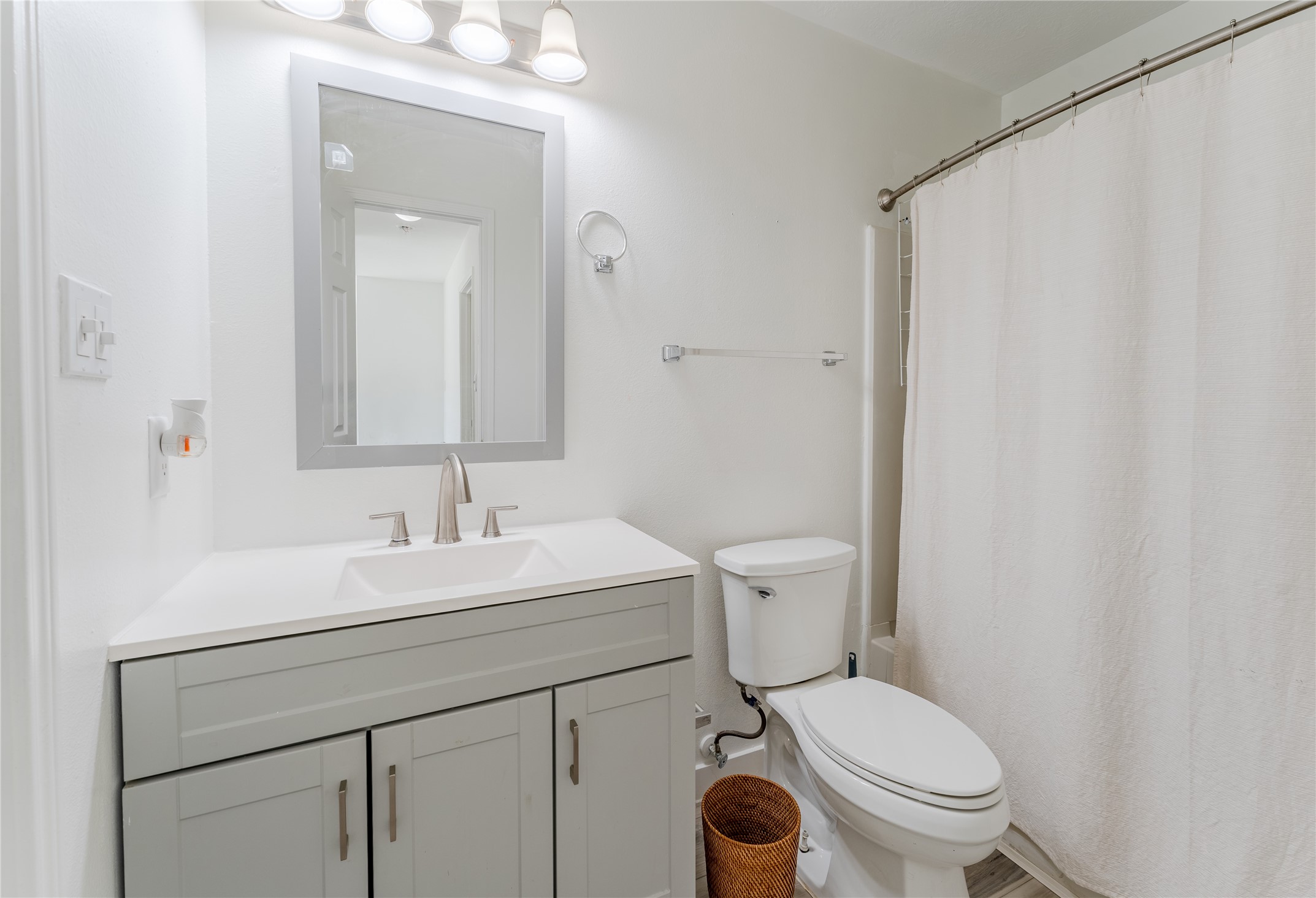 9203 Appin Court Houston, TX 77095 - Photo 22 of 38 a bathroom with a sink a toilet and a mirror