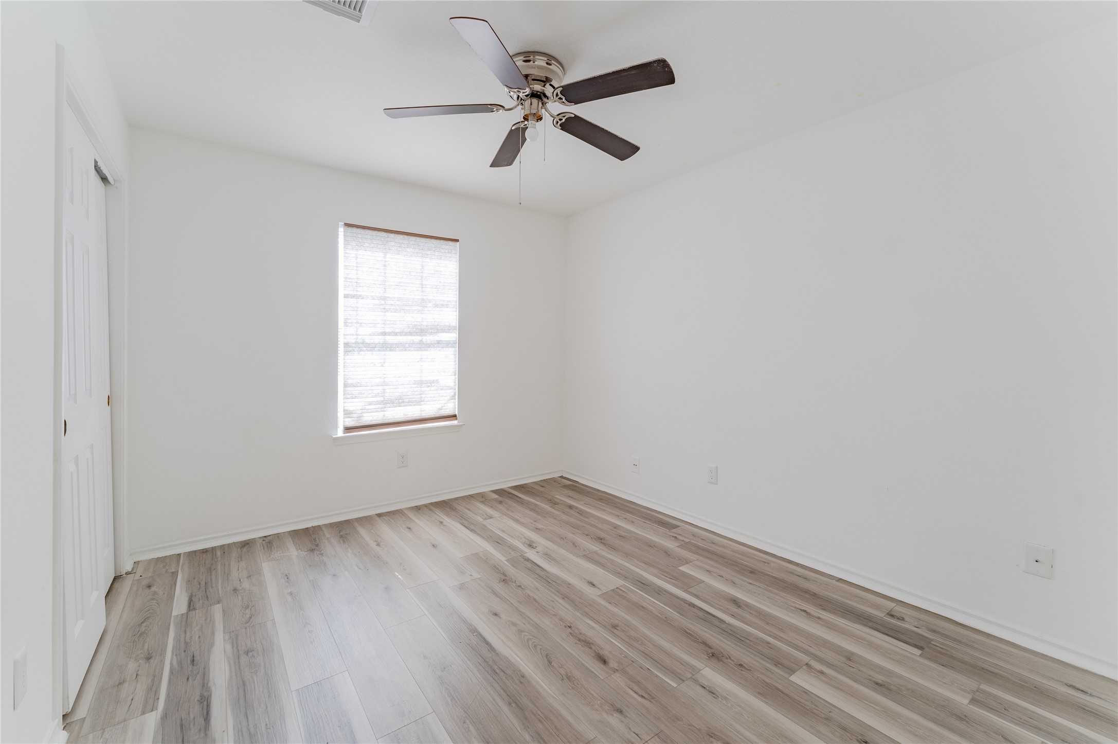 9203 Appin Court Houston, TX 77095 - Photo 23 of 38 wooden floor in an empty room with a window