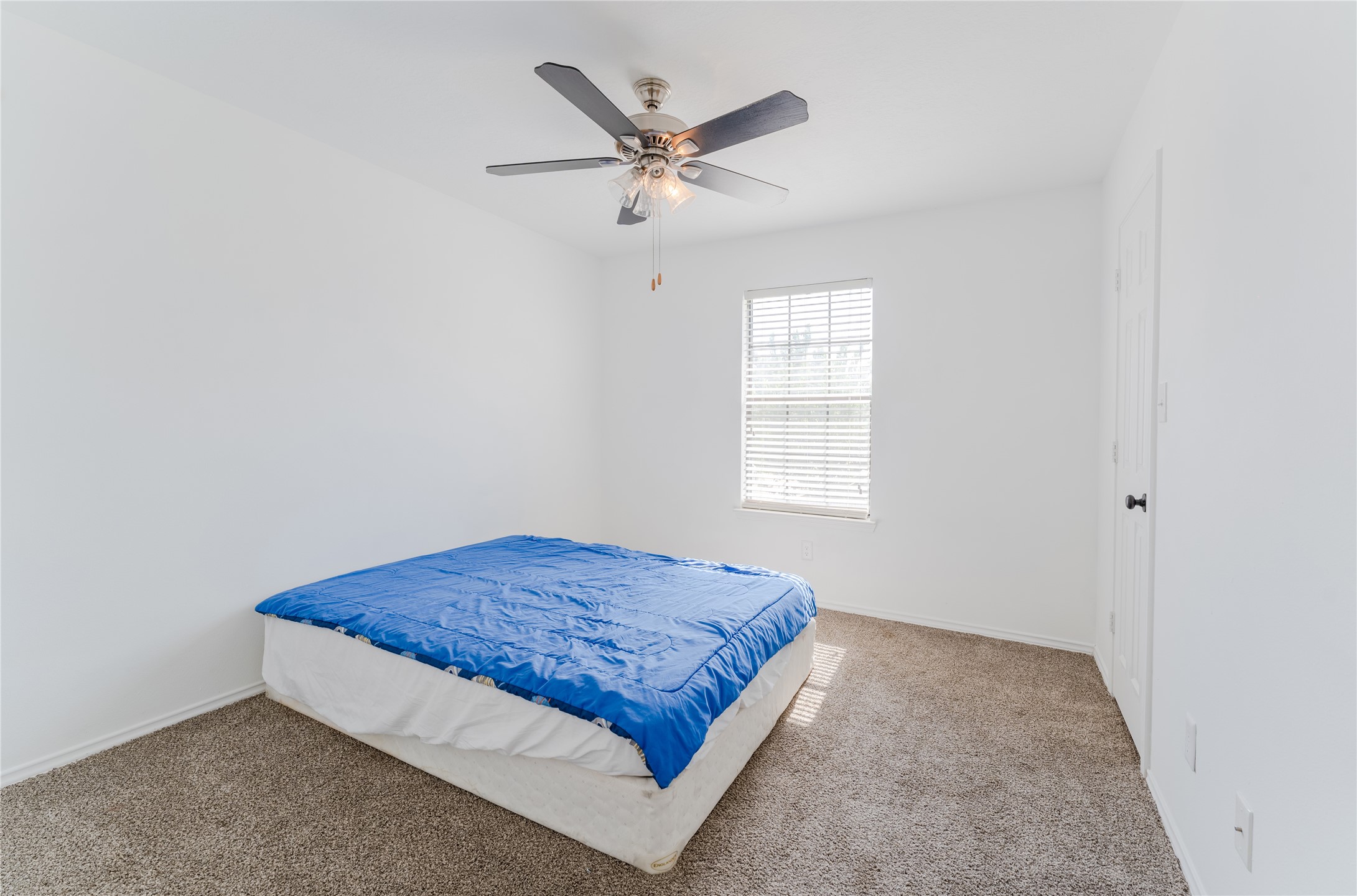9203 Appin Court Houston, TX 77095 - Photo 26 of 38 a bedroom with a bed and window