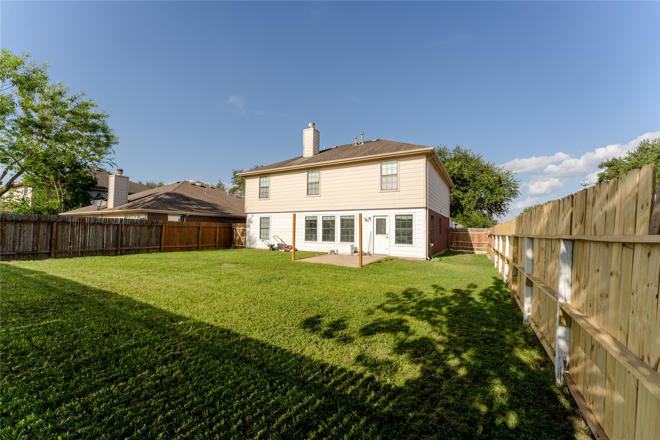 9203 Appin Court Houston, TX 77095 - Photo 32 of 38 a front view of a house with a garden