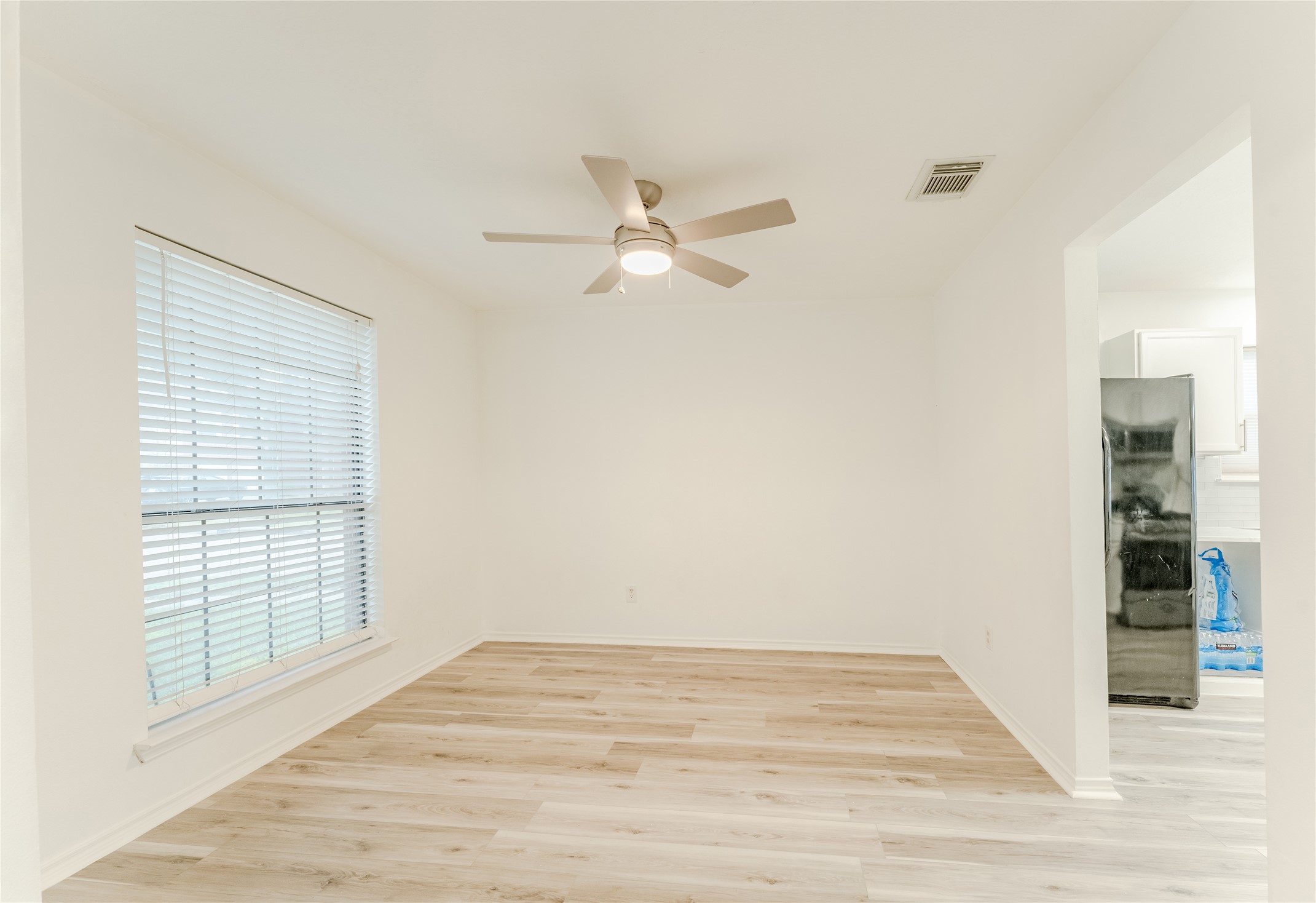 9203 Appin Court Houston, TX 77095 - Photo 5 of 38 an empty room with fan and windows