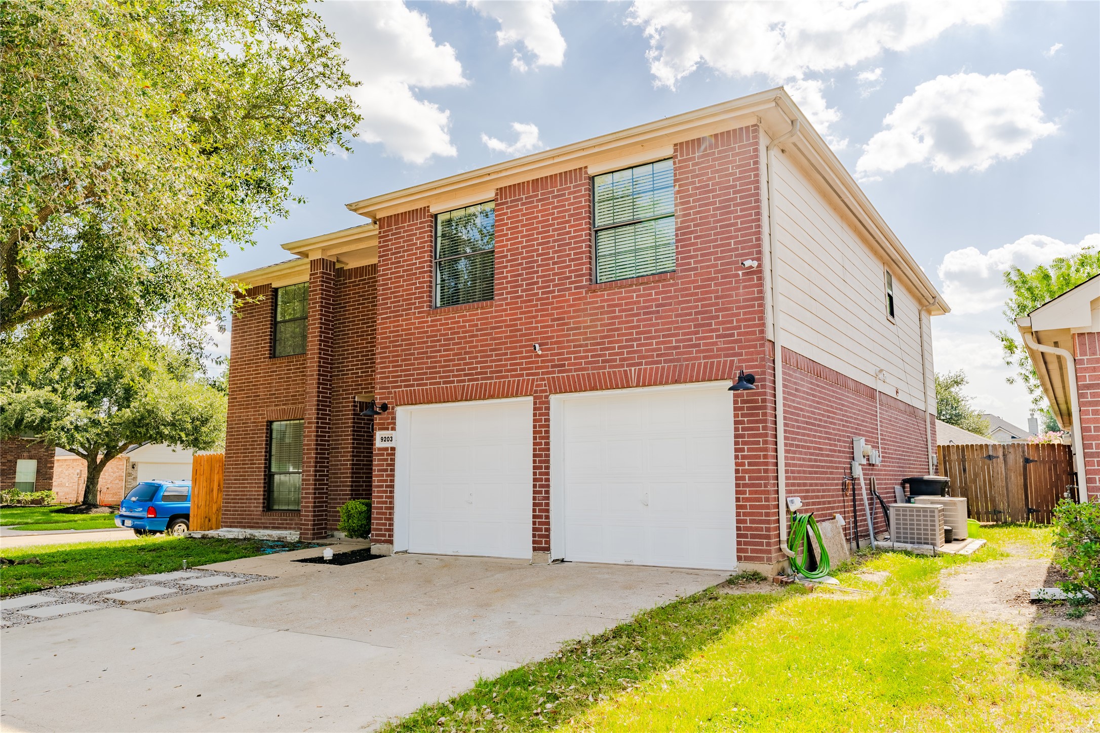 9203 Appin Court Houston, TX 77095 - Photo 6 of 38 a front view of a house with a yard