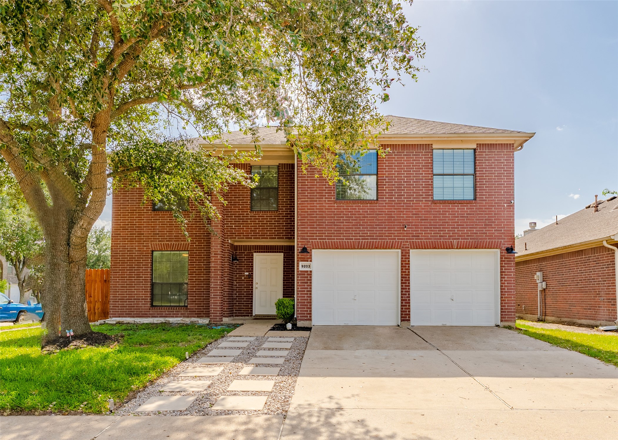 9203 Appin Court Houston, TX 77095 - Photo 7 of 38 front view of a house with a garden