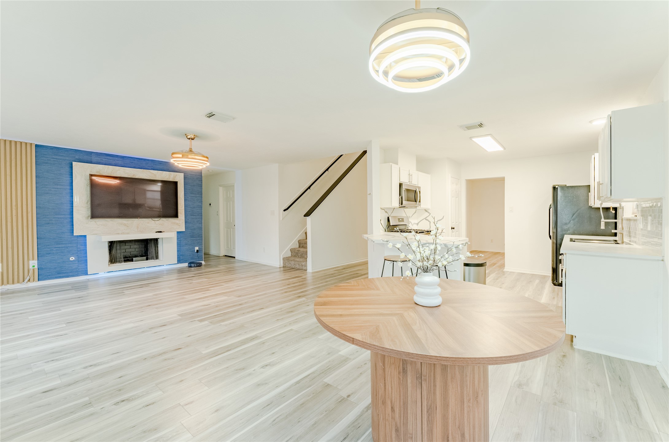 9203 Appin Court Houston, TX 77095 - Photo 10 of 38 a view of kitchen and dining room with wooden floor
