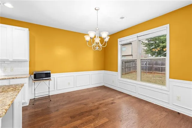 a view of kitchen with furniture and window