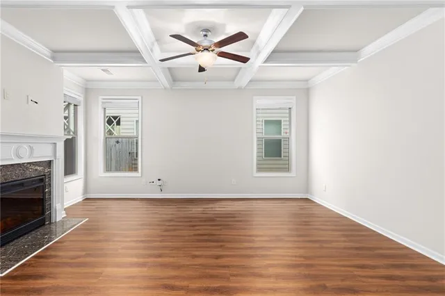 a view of livingroom with hardwood floor and a ceiling fan