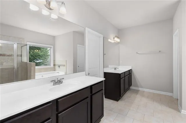 a bathroom with a sink vanity and a mirror