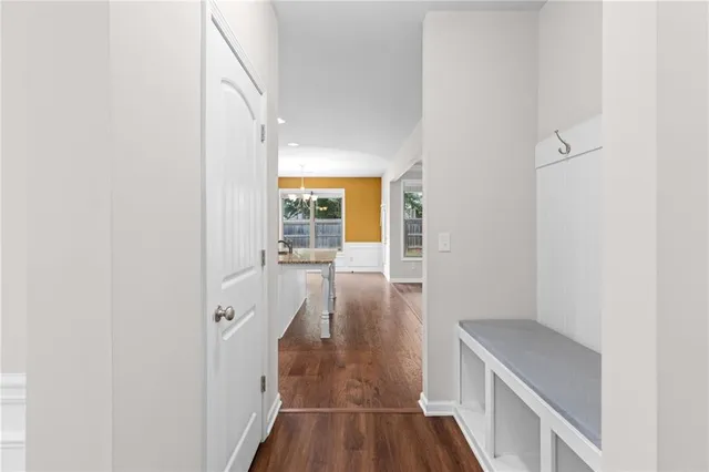 a view of hallway with wooden floor