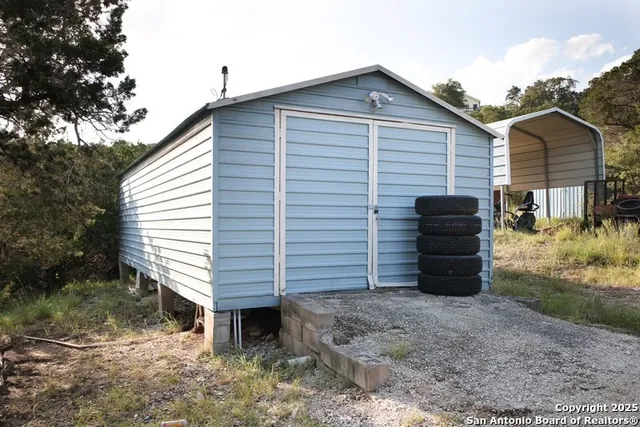 a view of a house with a back yard