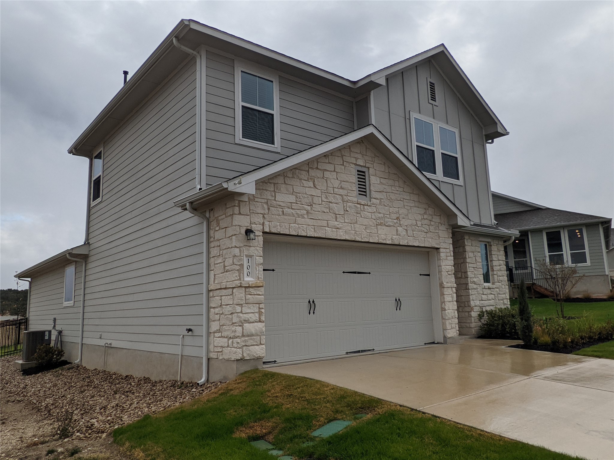 100 Montauk Loop Georgetown, TX 78628 - Photo 2 of 21 A charming exterior combines board and composite siding with stone veneer for appealing curb appeal.