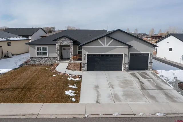 a front view of a house with yard