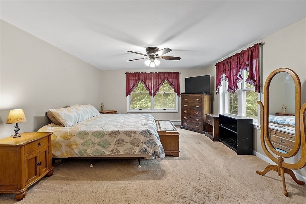 511 S Road Templeton, MA 01468 - Photo 15 of 33 a bedroom with bed and a chandelier