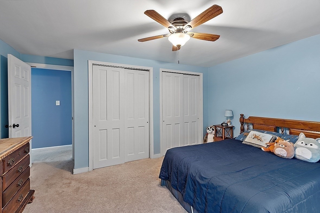 511 S Road Templeton, MA 01468 - Photo 21 of 33 a bedroom with a bed and a chandelier